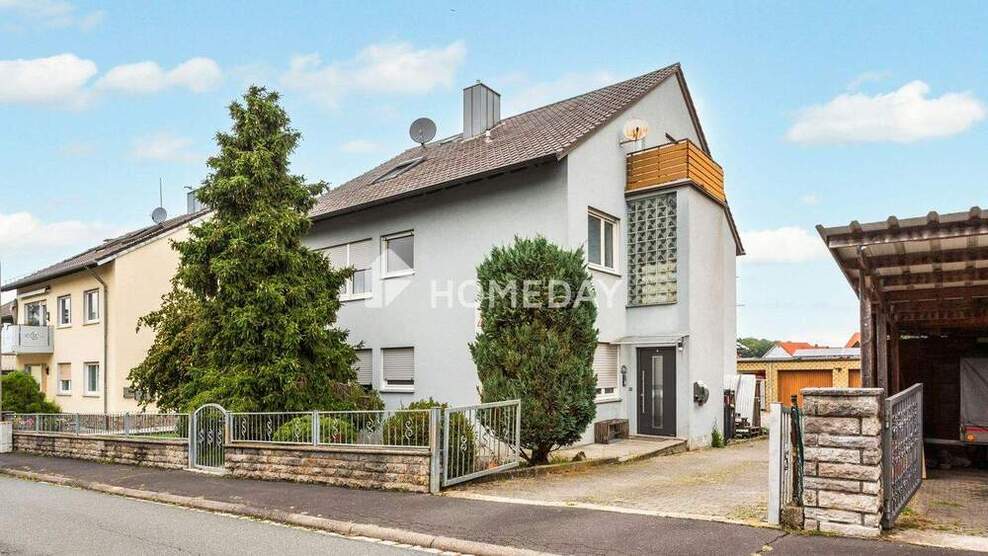 Vielseitiges Einfamilienhaus mit zwei Wohneinheiten, Garagen und Nebengebäude in ruhiger Lage 1 zimmer